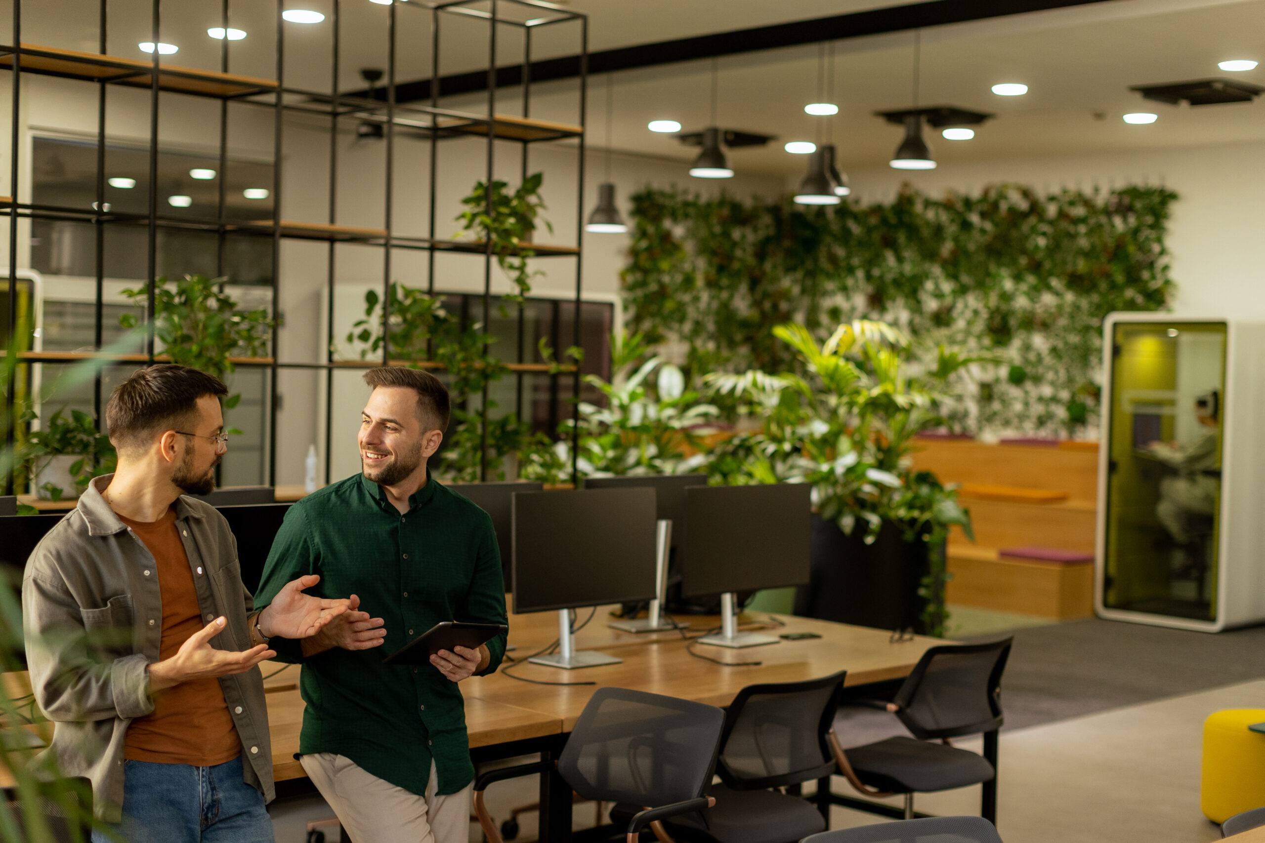 Collaborative Discussion in a Modern Office With Exposed Brick W