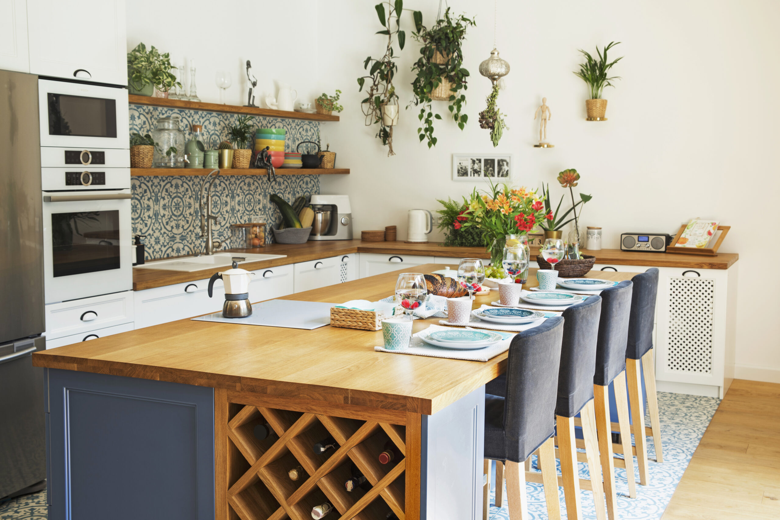 Stylish design of kitchen space interior with dining table, chai
